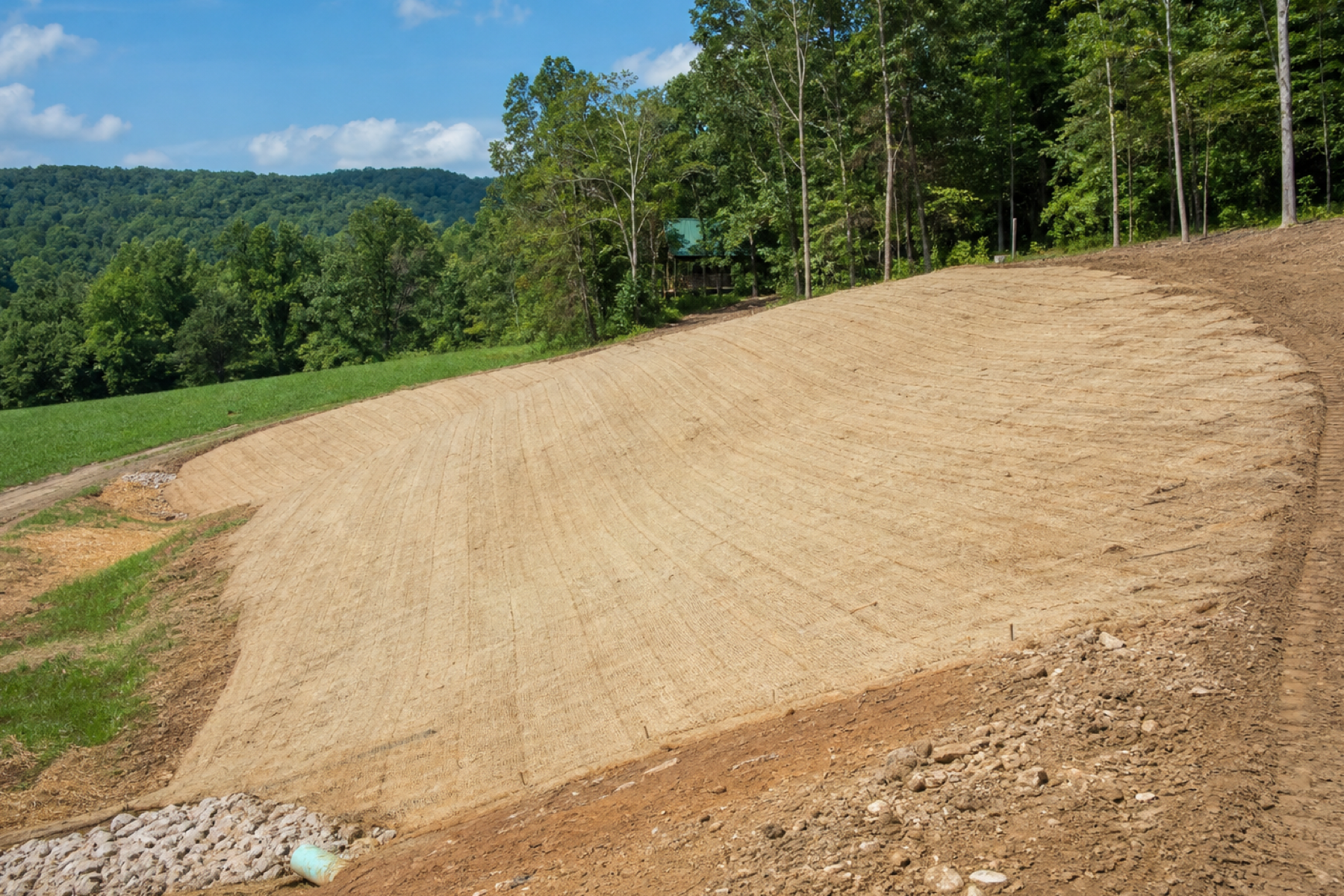 Erosion control matting on a freshly graded slope
